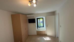 an empty room with a sink and a window at Holiday Home Traum in Krk
