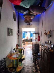 a room with tables and umbrellas on the ceiling at durmaaquislz in São Luís