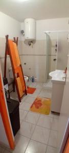 a bathroom with a shower and a toilet and a sink at Tropical Orange House in Ducos +9 photos