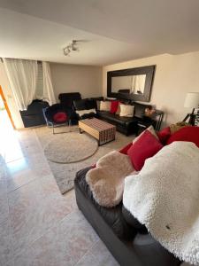 a living room with a couch and a table at Los Marianos 