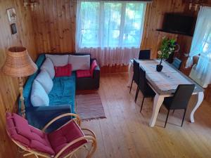 a living room with a couch and a table at U Peterki in Woryty