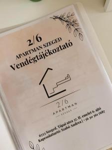 a label for a wine glass on a plate at 2-6 Apartman Szeged in Szeged