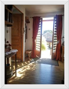 an open door to a room with an open door at Chambre d'hôtes de Marie in Chémery