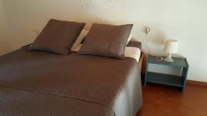 Postel nebo postele na pokoji v ubytování La Cigale