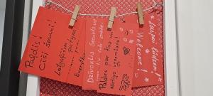 a bunch of red posters hanging on a clothes line at Dzīvoklis Baldone, Latvija in Baldone