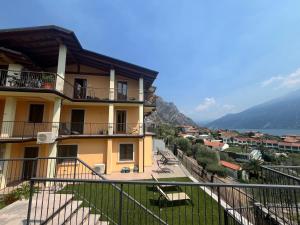 a view from the balcony of a building at Villa Imelda, panoramic apartments with Lake Garda views in Limone sul Garda +13 photos