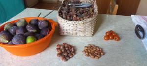 a table with a basket of vegetables and a basket of nuts at Retro Kvirike in Kvirike