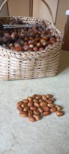 a basket of almonds sitting next to a basket of nuts at Retro Kvirike in Kvirike