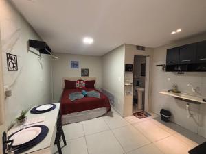 a bedroom with a bed and a sink in it at Flats 1778 N01 Orla de Petrolina in Petrolina