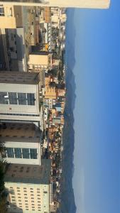 an aerial view of buildings and the ocean at Ayden Residence Béjaïa in Bejaïa