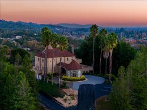 an aerial view of a house with palm trees at Bella Villa Messina in Healdsburg +37 photos