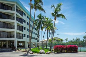 a rendering of the exterior of a hotel with palm trees at Oceanfront 5th Floor Penthouse in Key Largo