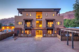 a large apartment building with a parking lot at 57 Robber's Roost in Moab