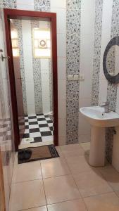 a bathroom with a sink and a shower with a toilet at غرفة وصالة في موقع مميز ترخيص ضيافة خاصة in Khamis Mushayt