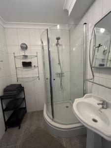 a bathroom with a shower and a sink at Franciscus in Bergen op Zoom +22 photos