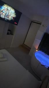 a room with a flat screen tv on the wall at Dream Wellness Suite in Barletta