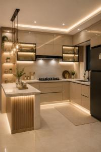 a kitchen with a counter and a refrigerator at ErviApartments in Tirana