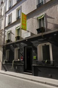 a building with a sign on the side of it at Hotel Bel Oranger Gare de Lyon in Paris