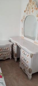 a vanity with a mirror and a dressing table at City Homes in Makurdu