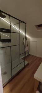 a glass shelf in a room with a ladder at The Cherry Tree Place in Góis +20 photos