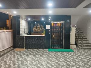 a door in a room with a tile floor at HoTEL MADHAVI PRIME in Guntūr