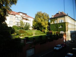 a white truck parked in front of a building at Cute apartment close to the center in Budapest