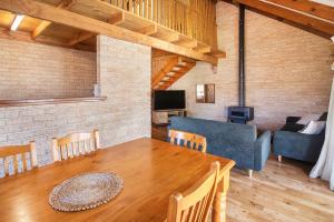 a living room with a table and a couch at Riverscape Cottages in Augusta