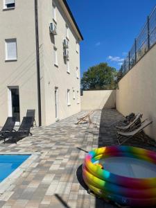 a colorful frisbee laying on the ground next to a building at Villa Pazar na dlanu in Novi Pazar