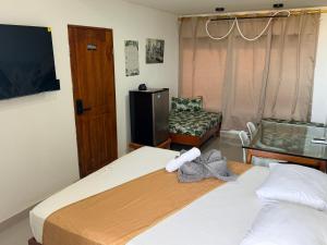 เตียงในห้องที่ Markasa Hotel boutique