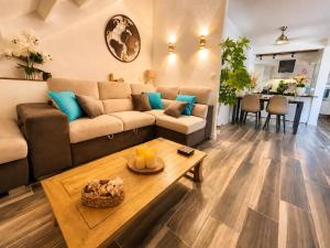 a living room with a couch and a table at Ocean Eleven Boutique Stay - Sea View Sunset Terrace in Sainte-Anne