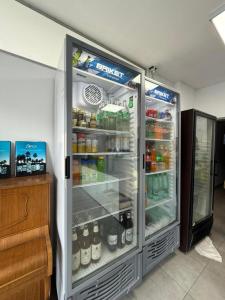 a refrigerator filled with lots of food and drinks at Hotel Diamante in Resistencia