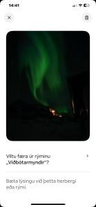 a screenshot of a cell phone with a video screen of the auriction at Vestra-Fíflholt hús 5 in Hvolsvöllur