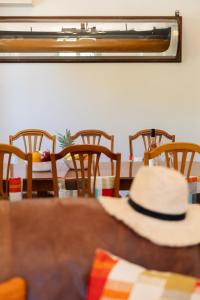 a hat sitting on top of a table at Villa Katerina BBQ & pool! in Metaxáta