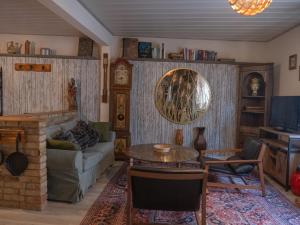 a living room with a couch and a table at Finca South Sahara in Bruchsal