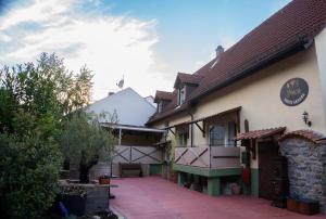 a building with a sidewalk in front of it at Finca South Sahara in Bruchsal