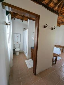 a bathroom with a toilet and a sink at Tranquility Bay Resort in San Pedro +101 photos