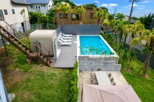 an aerial view of a backyard with a swimming pool at IPC Resort富津竹岡 in Futtsu