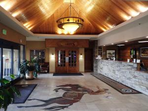 a lobby with a hotel entrance with a horse mural on the floor at Western Heritage Hotel and Conference Center, an Ascend Collection Hotel in Casper +33 photos