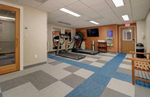 a fitness room with treadmills and exercise equipment at Anchorage Inn & Suites - Portsmouth in Portsmouth