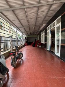 a hallway with a motorcycle parked in a building at Phú Hiệp Hotel in Thanh Xuân