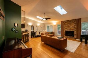 a living room with a couch and a fireplace at Cedar Retreat in McGaheysville