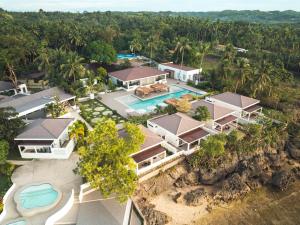 an aerial view of a house with a swimming pool at Cebu R Resort Tabuelan in Tabuelan