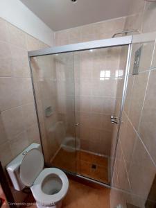 a bathroom with a shower stall with a toilet at York House in La Paz