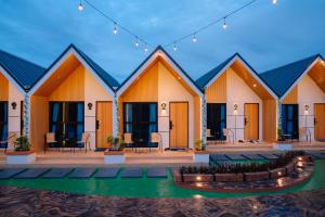 a row of cottages in a resort at night at D'Mount Sky Homestay Syariah in Bukittinggi