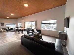 a living room with a couch and a table at The Bach in Lake Tekapo