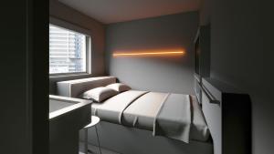 Ліжко або ліжка в номері BASE LAYER HOTEL Roppongi