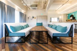 a living room with a couch and a table at Small Resort 志摩 in Shima +29 photos