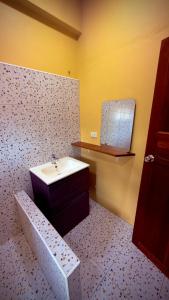 a bathroom with a sink and a mirror at One bedroom apartment Hin Kong in Ko Phangan