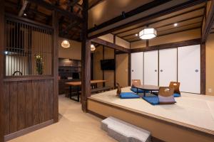 a room with a table and chairs and a dining room at Temple Stay KAN 観 in Yokosuka