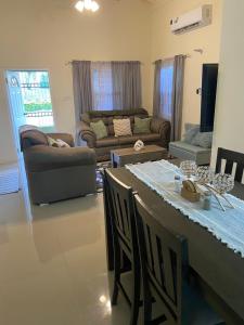 a living room with a table and a couch at Winslow Place in Falmouth